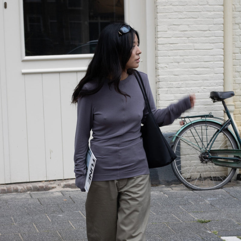 Socoworld women’s fashion featuring a fitted soft cotton extra long sleeve grey top and relaxed beige sage barrel trousers, Scandinavian Japanese minimalist clothing and Copenhagen street style.